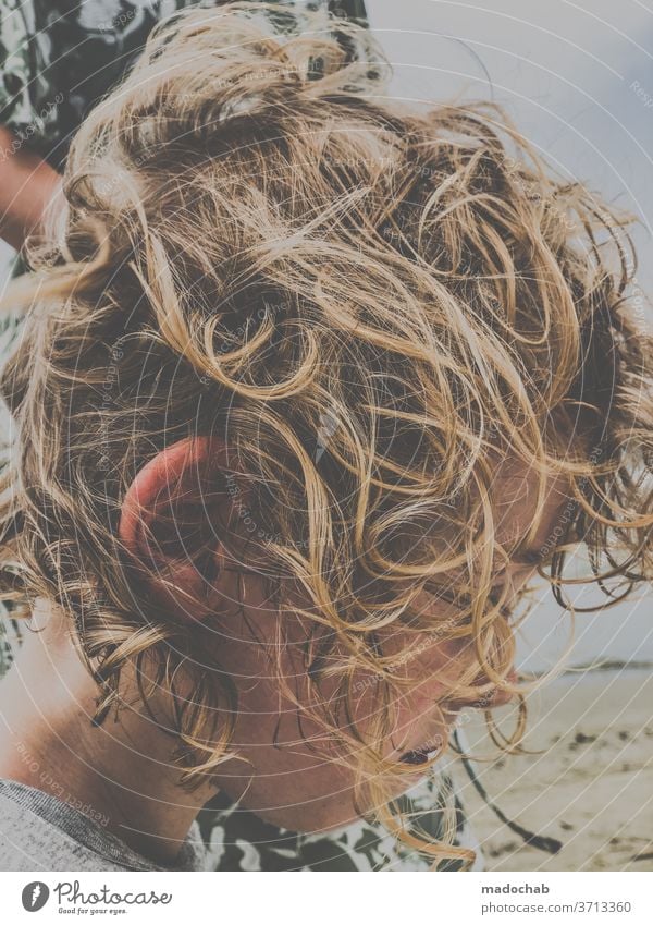 fuzzy head Child hair hairstyle Blonde Curl Curly Hair and hairstyles Face Hairdresser Untidy comb uncombed Muddled Human being Boy (child) Beach bathe Downward