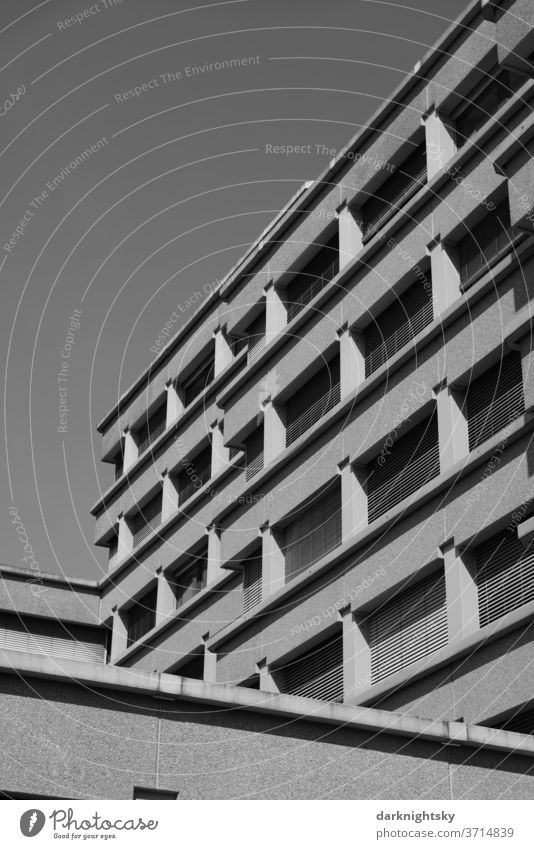 Concrete architecture in black and white Architecture built office brutalism Planning Build Redevelop Facade Window Grid