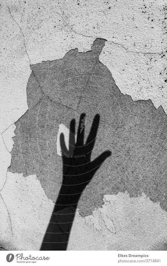 Shadow of a hand on an old wall shadow pictures Wall (building) Old by hand cracks
