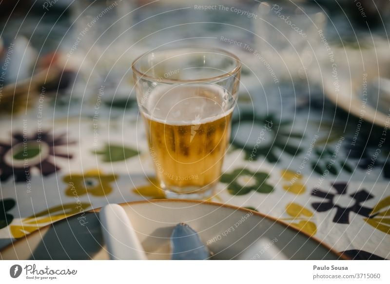 Glass of beer on a table Beer Cold drink Gastronomy Deserted Delicious Exterior shot Beer garden Day Beer glass Colour photo Beverage Drinking Alcoholic drinks
