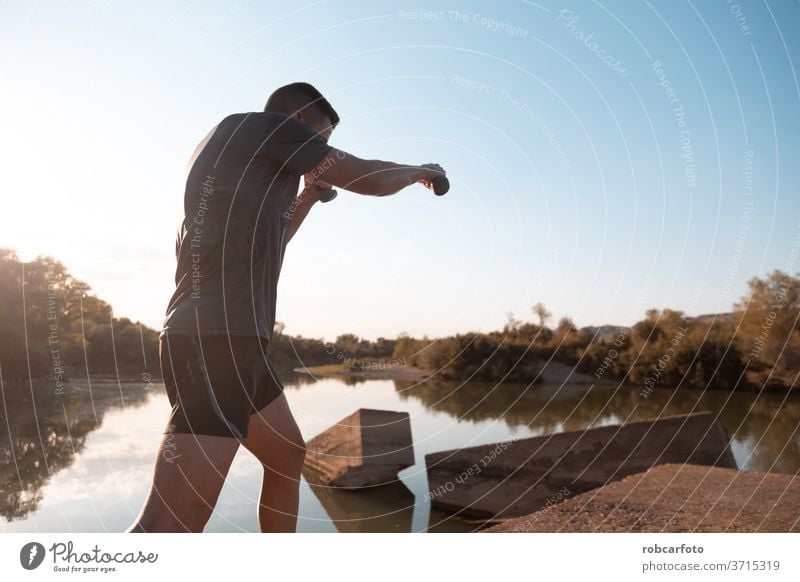 man training next to river male athletic sport jogger bridge healthy workout outdoor lifestyle active athlete sky sporty runner working men fitness exercise