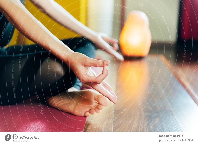 detail of woman's hands in relaxation yoga position health contemplation harmonious exercise comfort class breathing sitting pretty indoors practice prayer