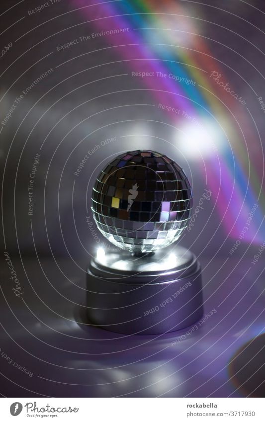 disco ball in front of rainbow light Light Reflection Feasts & Celebrations Party Disco ball Reflection & Reflection Rainbow
