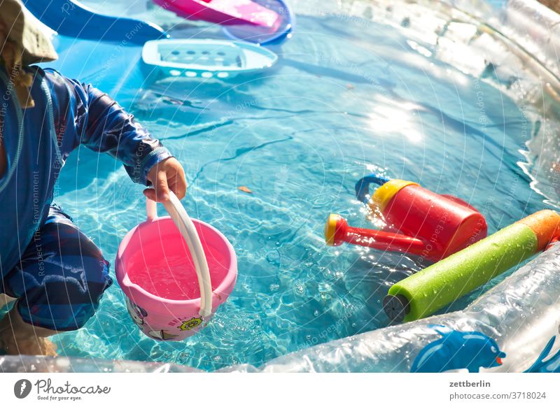Little child in the small swimming pool pool swinningpool Basin Water Water basin Paddling pool bathe Summer midsummer ardor game Toys water toys Bucket