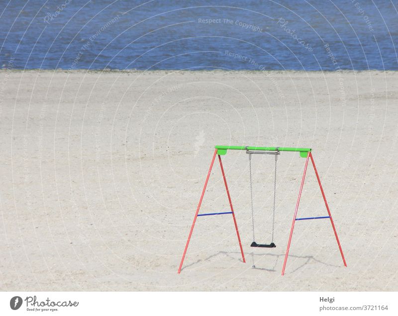 Swing on the lonely North Sea beach | Anticipation Beach Sand Water Ocean Beautiful weather Sunlight Light Shadow Loneliness tranquillity Exterior shot Coast