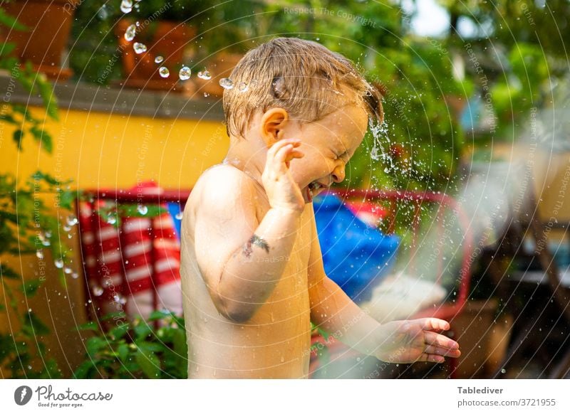 Boy gets splashed with water on the terrace and turns away Water Splash Inject Boy (child) Child Naked Skin Garden Balcony Terrace Paddling pool Garden Loop