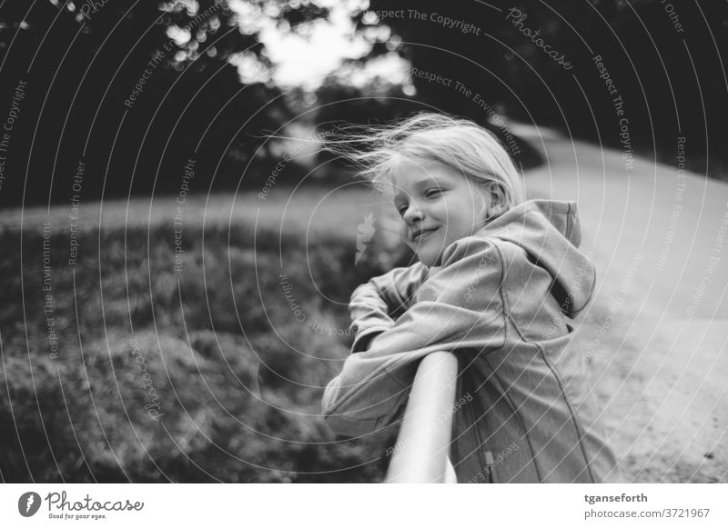 hair in the wind Child girl portrait windy fortunate happy child Laughter luck Contentment contented Infancy blowing hair Joy smile 8 - 13 years Human being
