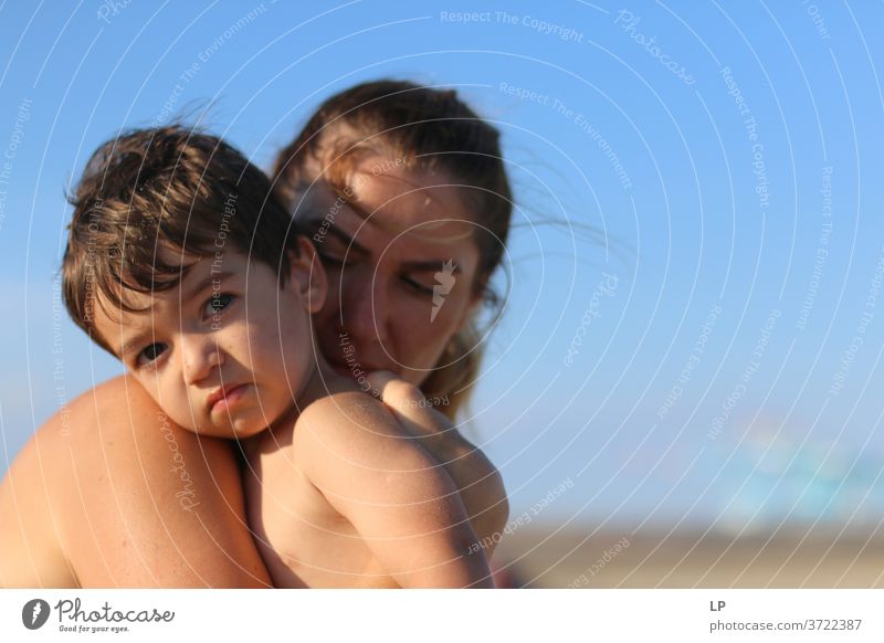 mother holding a child in her arms Mother Beach vacation Joy Warm-heartedness Serene Calm Sunlight Sadness Time Longing Endurance Contact Summer Mother's Day