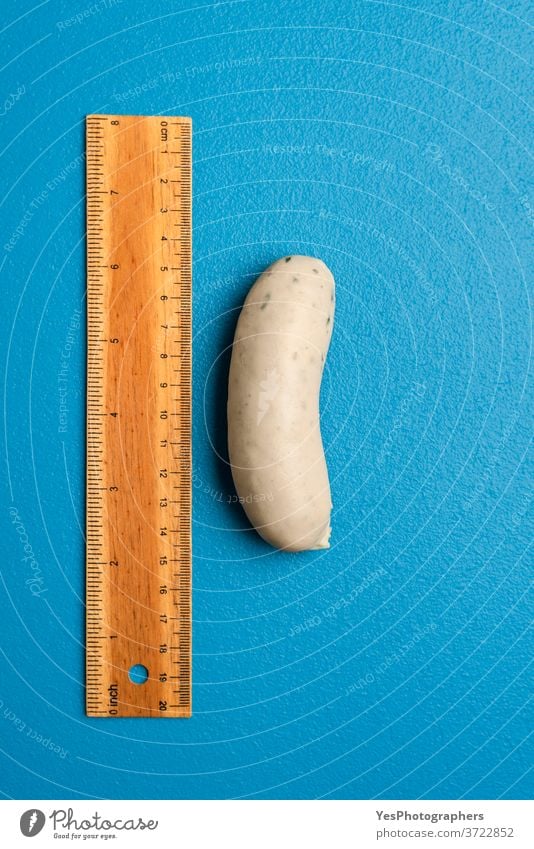 White sausage top view. Food quality control concept. Standard size Bavaria Germany Oktoberfest analyze background bavarian blue boiled cooked cuisine cut out