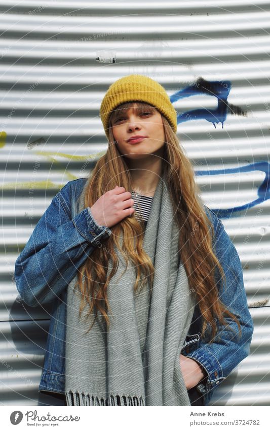 Portrait of a young woman Woman girl street long hairs cap Yellow Blue Blonde Cool already Attractive Model Fashion pretty Human being street style Street life