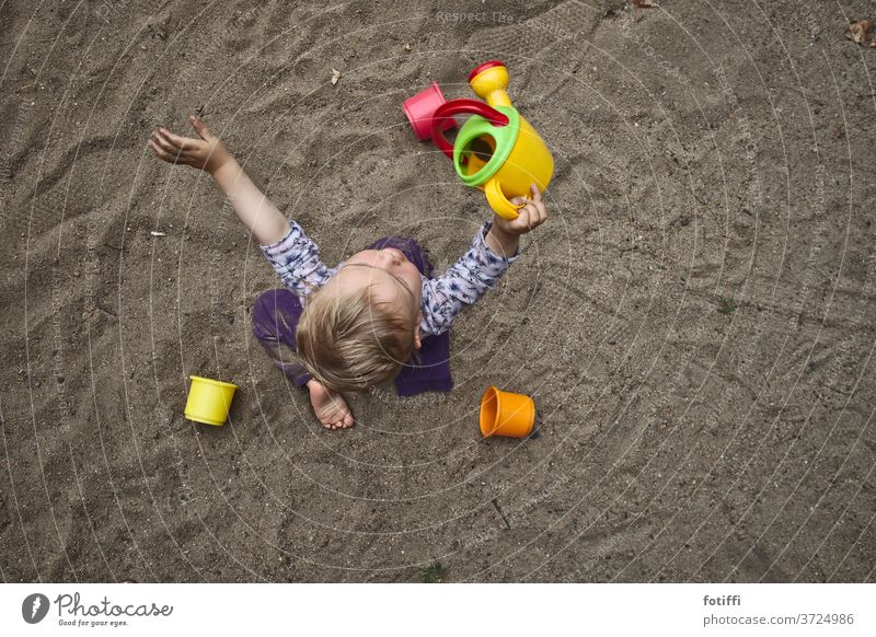 Toddler playing in the sand II Bird's-eye view Children's game Infancy Exterior shot Playground Playing Sand Sandpit