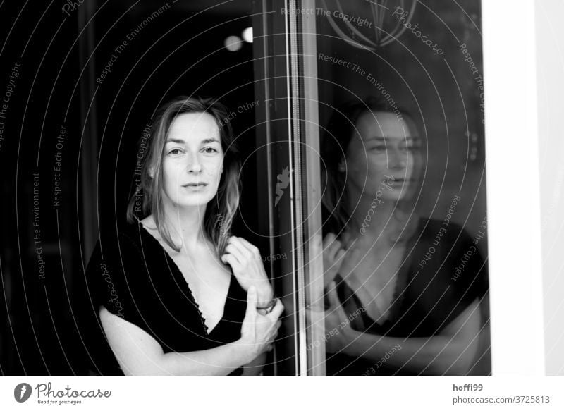 The woman and her reflection portrait Adults Young woman Feminine Style Black & white photo melancholy Movement Mysterious Emotions Head Think Meditative Dream
