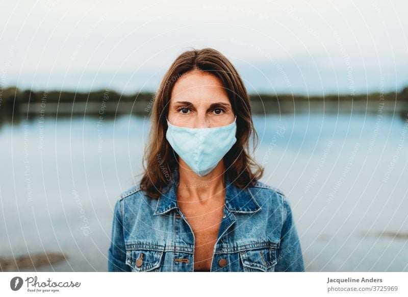 Woman wearing mouthguards in the Corona Pandemic Mask Face mask Protection coronavirus covid-19 pandemic COVID Virus Risk of infection Corona virus prevention