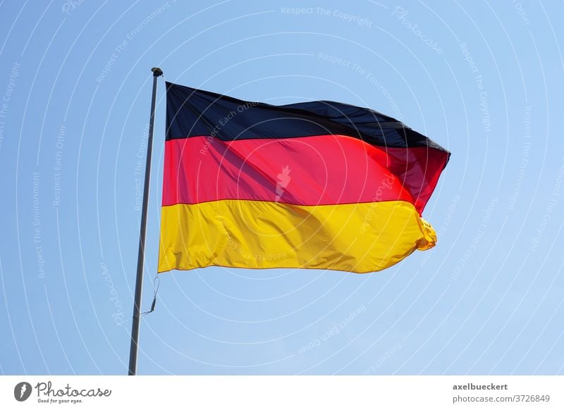 Flag of Germany against clear sky flag germany national black red gold yellow waving flagged banner federal republic color colour tricolour tricoloreurope