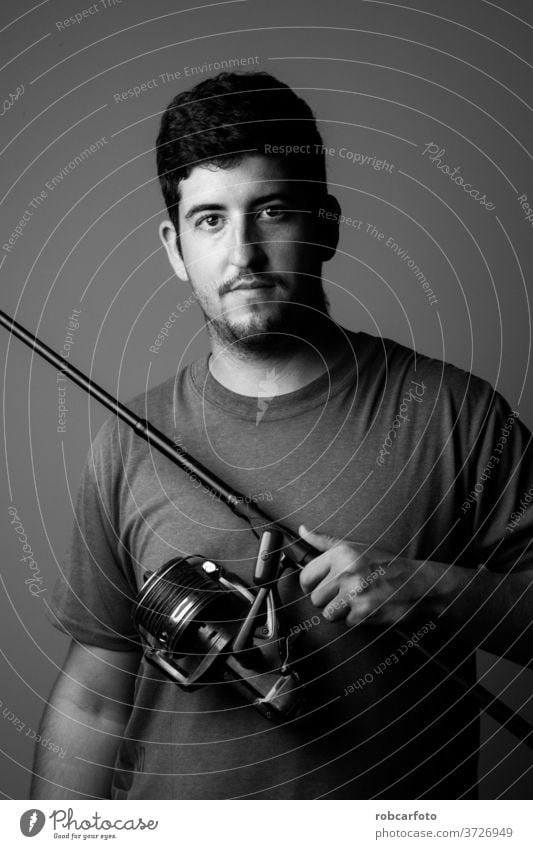 portrait river fisherman with fishing rod sport person relaxation recreation nature lake angler reel people catch casting summer male fun water equipment one