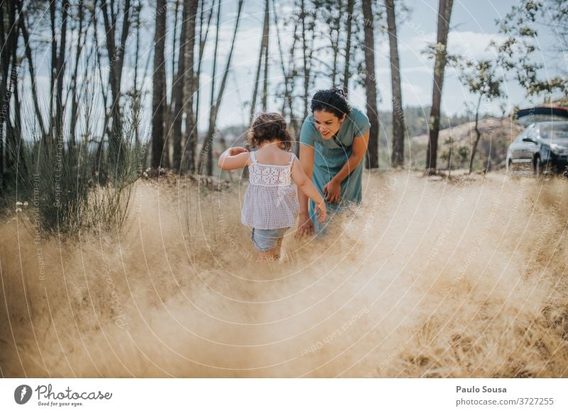 Mother and daughter playing in the woods motherhood Mother with child Daughter Together togetherness Love Joy Woman Lifestyle Happiness Beautiful Happy Cute