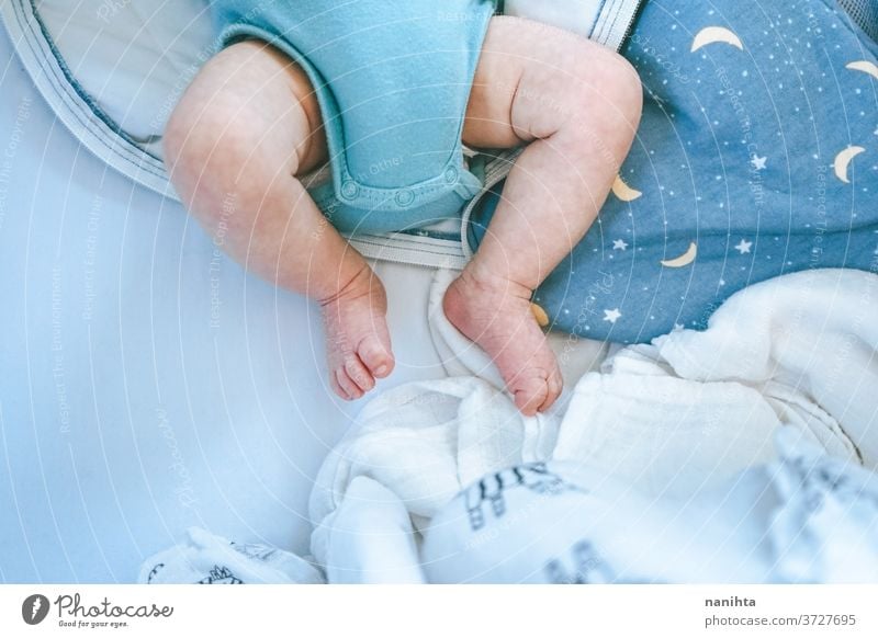 Close up of newborn legs at home baby body parts close up lovely skin feet foot bed sleep sleeping dream dreaming daydreamer cute cutie adorable dry dry skin
