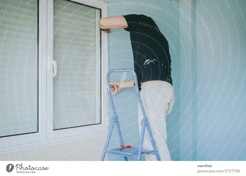 Man working in a room renovation reform home job house paint man male home improvement move removal relocation hard work work at home leisure active stairs
