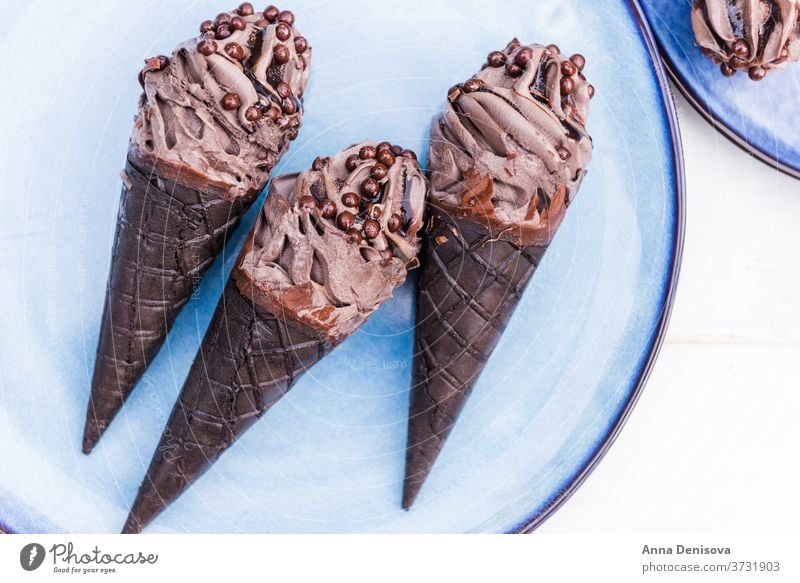Double Chocolate Ice Creams with Black Waffle Cones ice cream black charcoal double chocolate waffle trendy cone food goth japanese sweet dessert bamboo cold