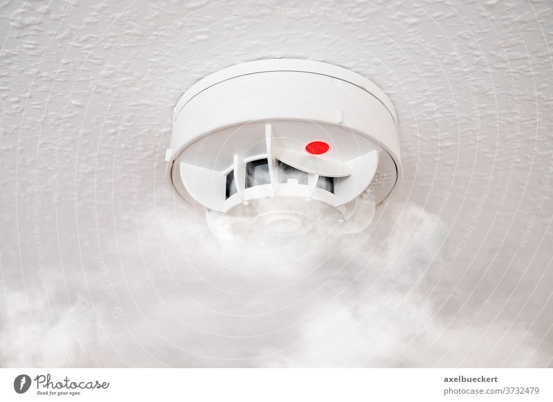 smoke detector or fire alarm smoke alarm household ceiling red light sensor protection prevention safety security home system domestic equipment technology