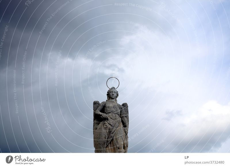 sculpture of a saint on a cloudy background Sculpture Rock wings Exterior shot Statue Religion and faith Architecture Culture Ancient Vacation & Travel Tourism