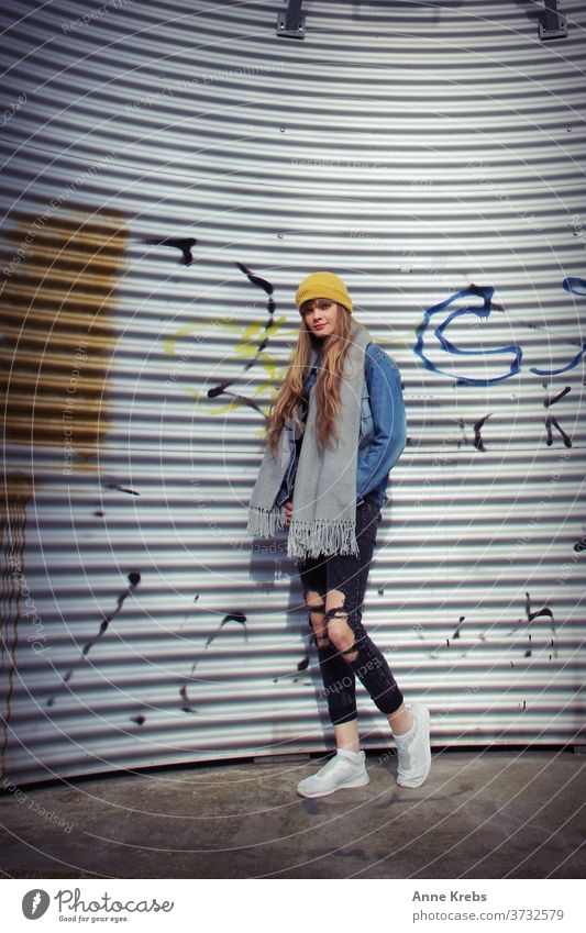 young woman in front of corrugated iron Woman girl street long hairs cap Yellow Blue Blonde Cool already Attractive Model Fashion pretty Human being