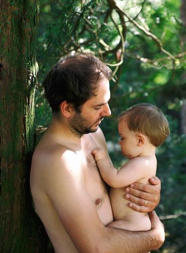dad with baby in the garden kid child boy having fun happy smile father enjoy tree nature outdoor blue eyes tender people portrait lifestyle family one people