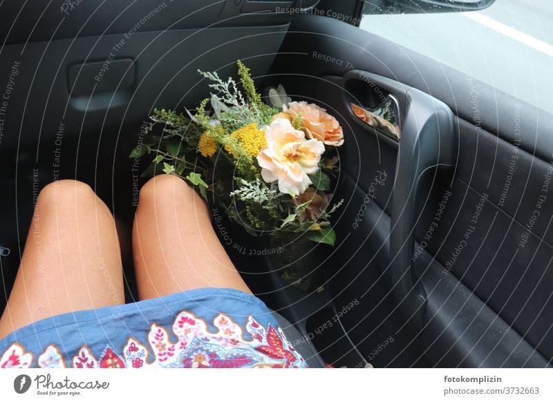 Bouquet of flowers next to women's legs on passenger side in the car blossoms Flower love Blossom Blossoming Love of nature floral greeting Plant Summerflower