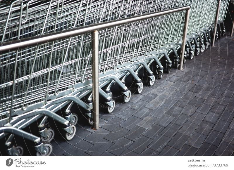 Shopping Cart purchasing Shopping Trolley Consumption Row SHOPPING Supermarket Provision weigh Metal Behind one another Steel pavement
