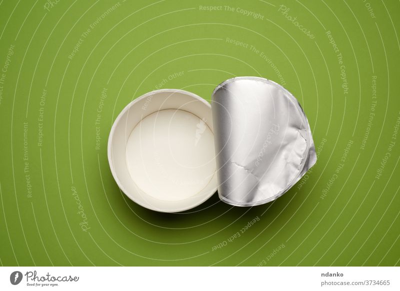 open empty cardboard noodle plate with foil roll on green background paper dinner traditional top above noodles lunch dish closeup meal food recycle white box