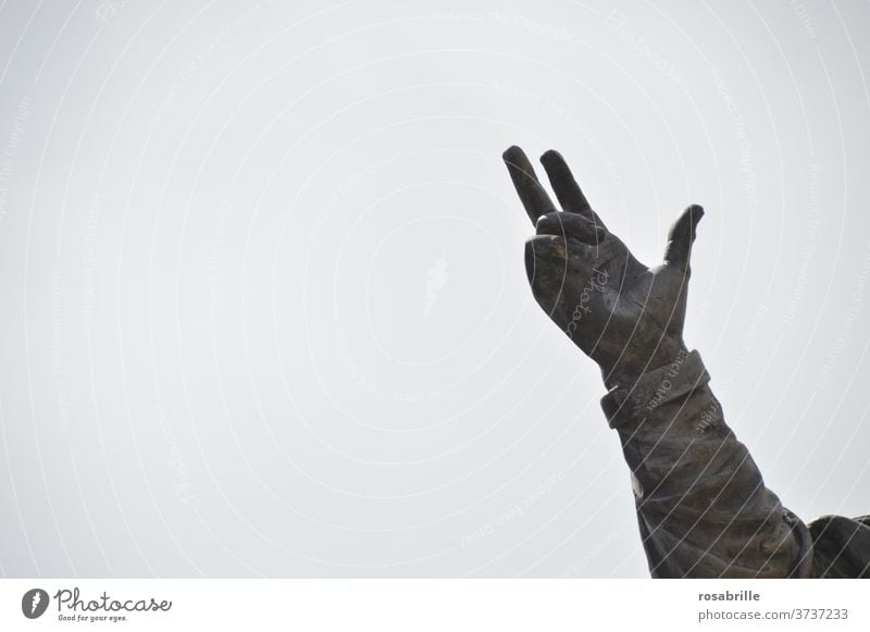 hand of a statue points to the sky | dynamic by hand Indicate Statue Sky hint Clue Tall Above Upward Interpret Show of hands Figure three fingers open space arm