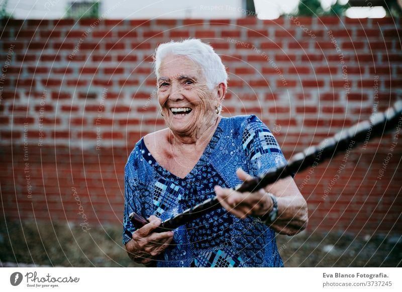 happy old lady smiling outdoors and having fun laugh joy woman portrait elderly home white hair grey hair mental grandmother aged health care looking emotion