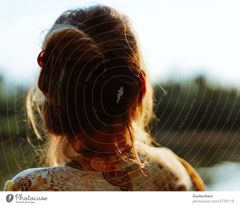 A little time-out - head of a woman against the light, looking over a lake Head Woman hair Back-light Sun already Lake tranquillity Peace relaxation thoughts