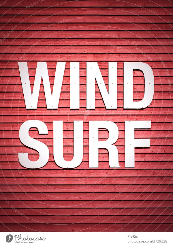 Wind Surf writing on red wall Surfing windsurfing Aquatics wood Wall (building) lettering Red hobby Letters (alphabet) Windsurfing boards Sports words