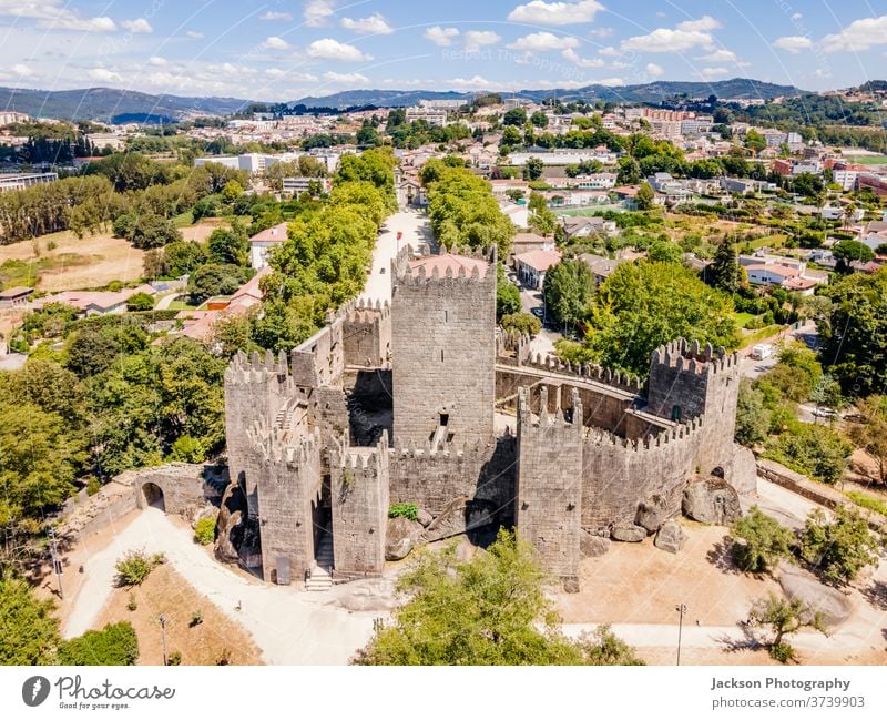 Aerial view of castle of Guimaraes, Portugal guimaraes portugal cityscape aerial town old tourism unesco world heritage palace cultural historical