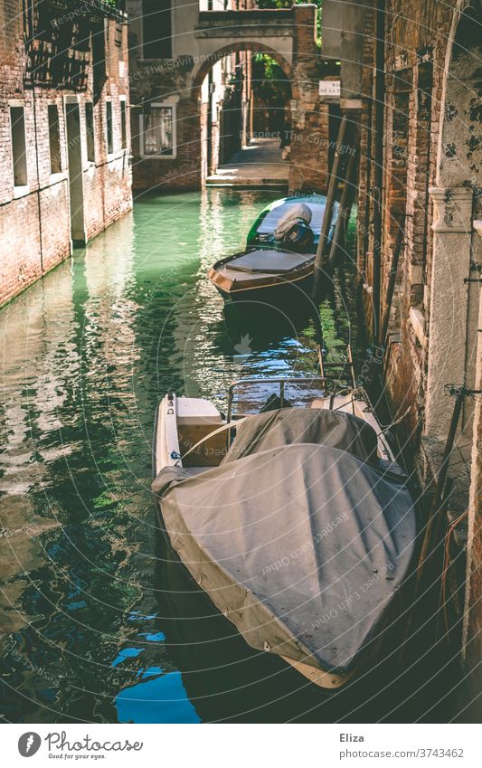 A canal in Venice Channel boat Old town Tourist Attraction arched gateways morbid Town Water Historic
