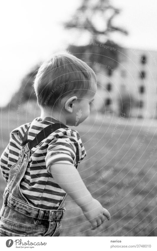 Toddler runs Child Infancy Black & white photo Running Boy (child) Walking Exterior shot Playing 1 Joy Joie de vivre (Vitality) Movement