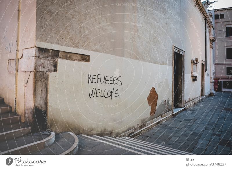 Refugees Welcome - also in Venice :) refugees welcome Fugitives Safe haven Graffiti Help Characters Humanity policy Solidarity Politics and state Responsibility