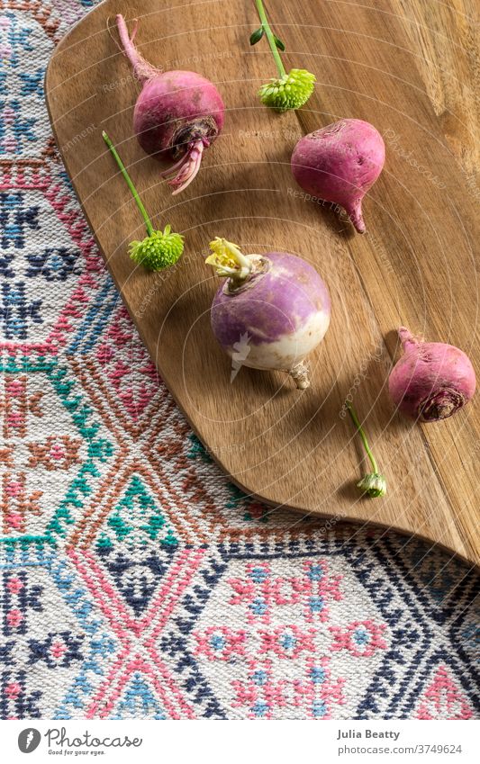 Still life with beets, rutabaga, chrysanthemums, wooden curtting board, and woven tribal cloth beetroot beetroots cutting board Wooden board Placemat Tribal