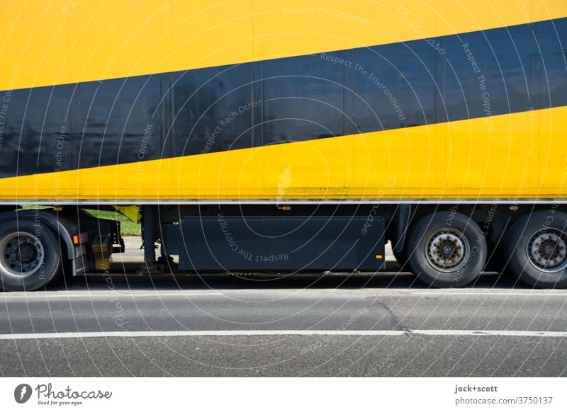 stripes black / yellow on axle Logistics Means of transport Truck Trailer lorry Asphalt Design Transportation vehicle trailer Parking Mobility Economy Trade