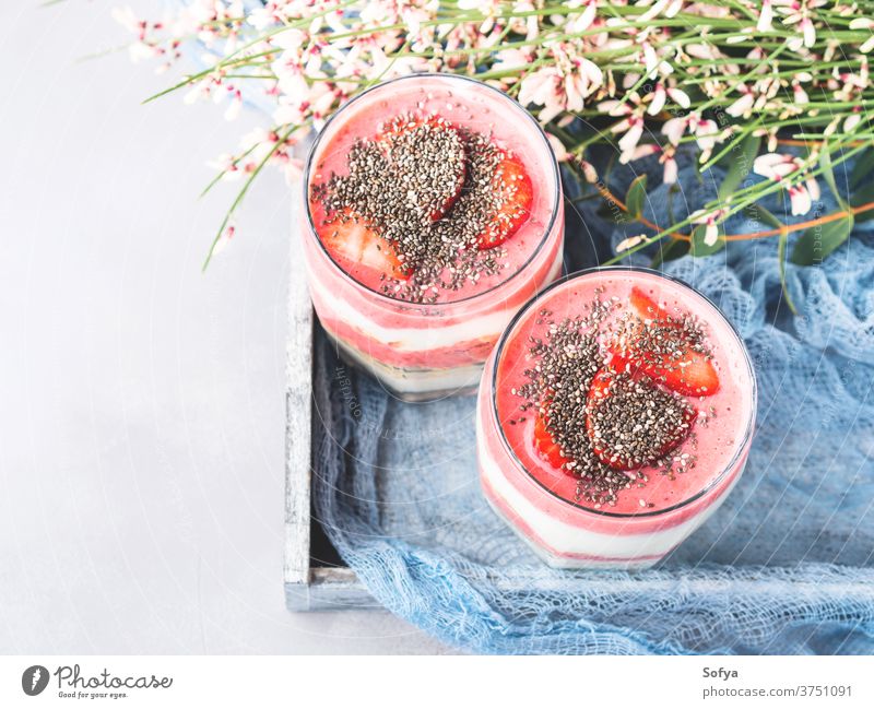 Yogurt strawberry fruit parfait with rolled oats yogurt breakfast oatmeal glass served chia seeds food healthy layer blended bowl smoothie light flowers diet