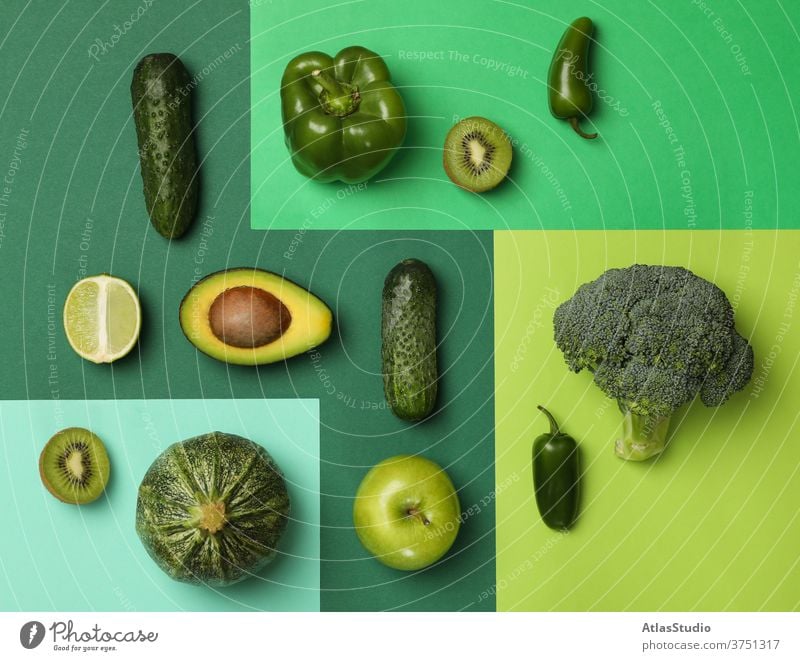 Fresh vegetables and fruits on multicolored background flat kiwi avocado cucumber cabbage concept pepper apple healthy texture diet broccoli lime food lettuce