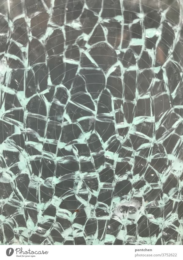 A broken glass pane. Broken glass. Broken, shattered. Pattern, structure Glass shards Vandalism Insurance glass insurance Destruction Window pane Transience