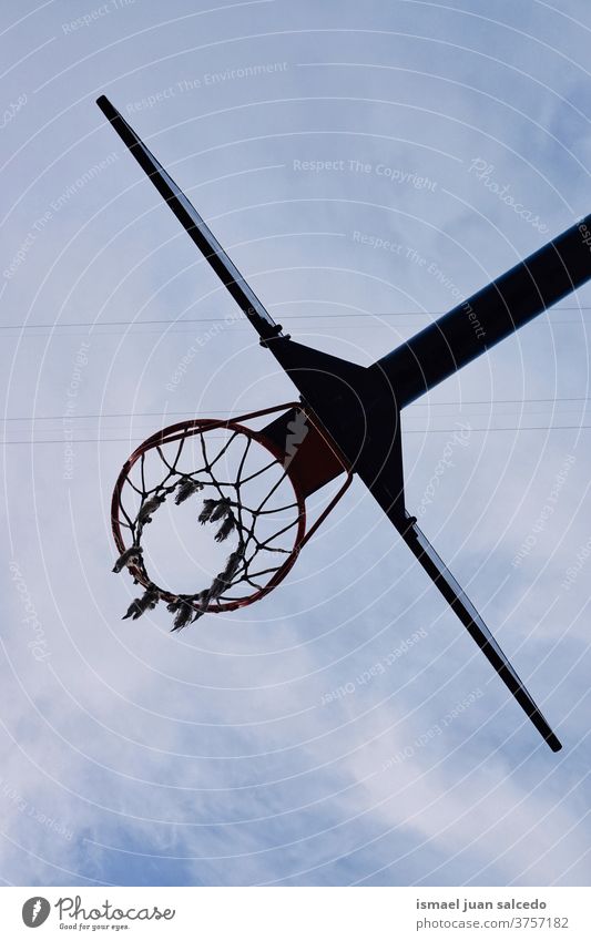 street basketball hoop in Bilbao city, Spain sky blue silhouette circle chain metallic net sport sports equipment play playing playful old park playground