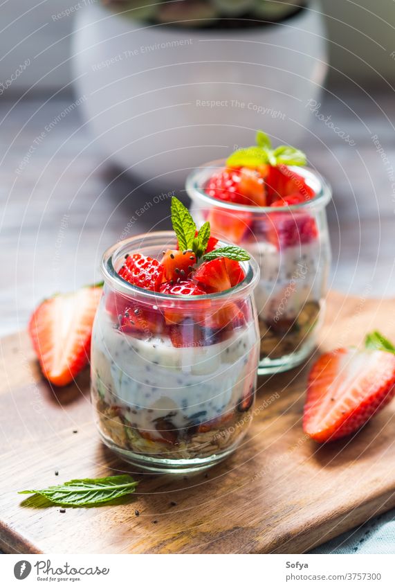 Yogurt and granola with strawberries. Breakfast strawberry breakfast dessert yogurt food fruit glass healthy sweet gourmet morning pudding vegan cereal