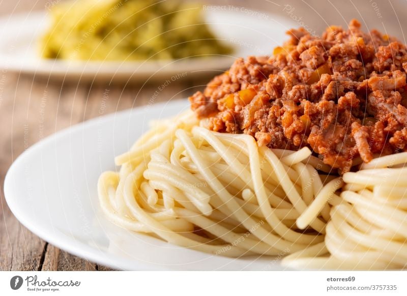 Spaghetti with bolognese sauce on wooden table spaghetti beef cheese food pasta cuisine italian dinner dish homemade italy meat parmesan plate recipe served