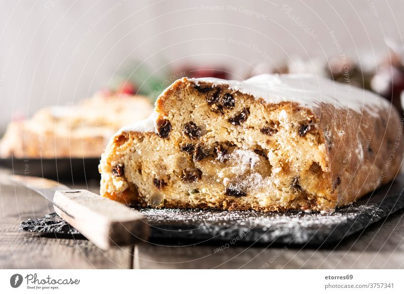 Christmas stollen fruit cake on wooden table. almond bakery celebration christmas delicious dessert food german german dessert holiday homemade marzipan pastry