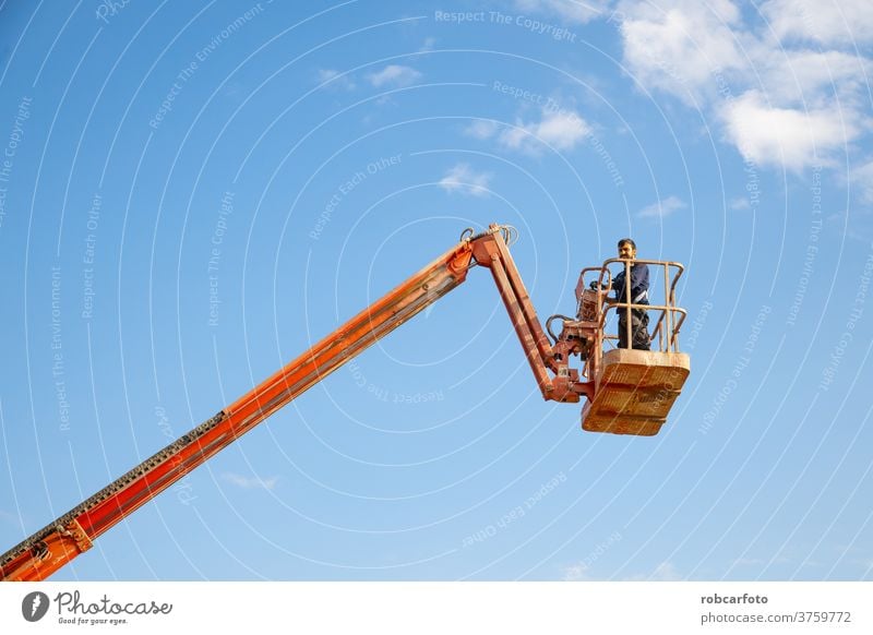 man working at heights with lifting platform. safety equipment industrial industry elevator mechanical construction crane worker hydraulic high aerial erector