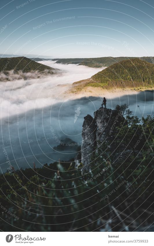 man on rock over fog Nature natural spectacle natural beauty mysticism Fog Sea of fog hillock Swabian Jura Stone Cliff Grass early morning mist person