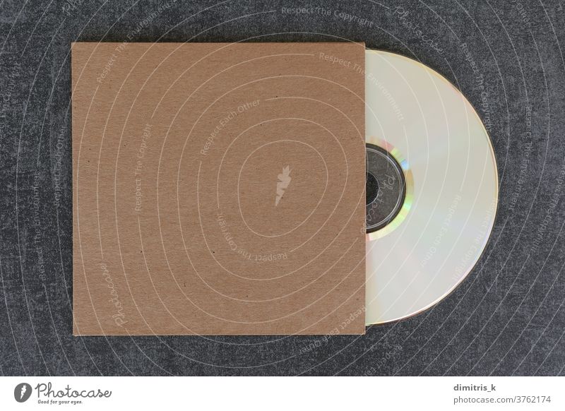blank compact disc cd and generic cardboard sleeve mockup dvd cover white label brown template copy-space design cdr empty background music audio data digital